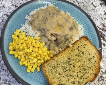 Pork Chops with Creamy Mushroom and Onion Sauce, Sides, and Garlic Bread: